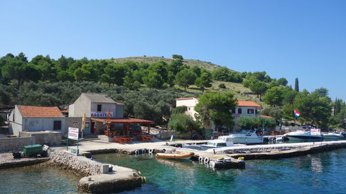 Calm sea with buildings in background