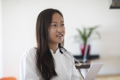 Young asia female doctor with report in a practice