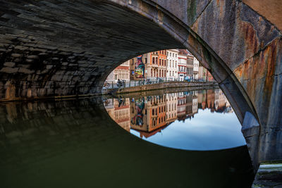 Arch bridge over canal in city