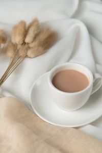 High angle view of coffee cup on table