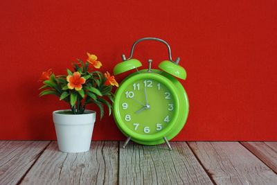 Close-up of alarm clock on table