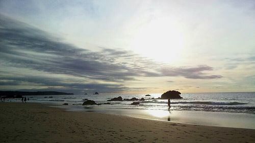 Scenic view of beach against sky during sunset