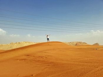 Woman on the desert, scenic view 