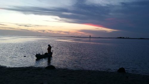 Scenic view of calm sea at sunset