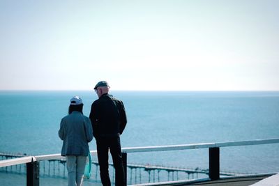 Man looking at sea against sky