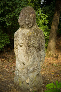 Statue of tree in cemetery