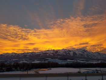 Scenic view of dramatic sky during winter