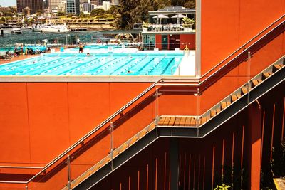 High angle view of swimming pool by building