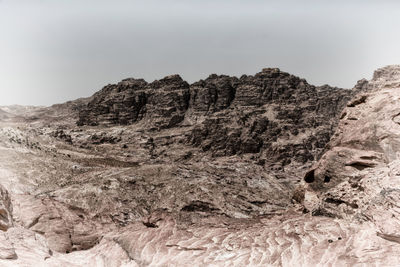 Low angle view of rock formations in desert against sky