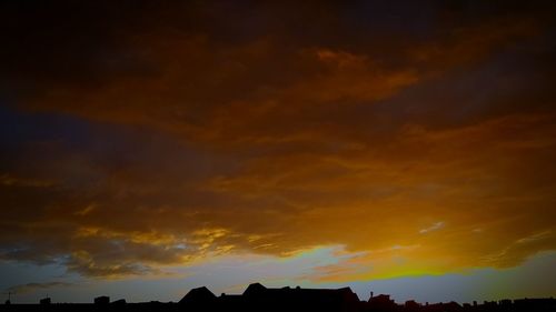 Low angle view of dramatic sky during sunset