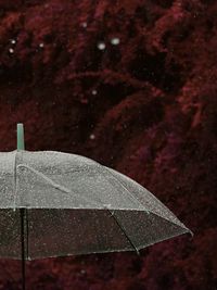 Close-up of water drops against sky at night