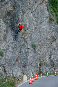 High angle view of people walking on rock