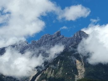 Low angle view of majestic mountain against sky