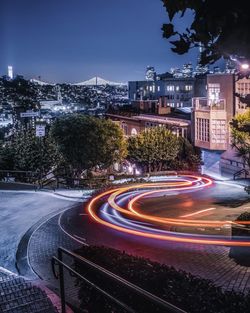 High angle view of light trails on road at night