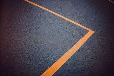 High angle view of yellow line on road