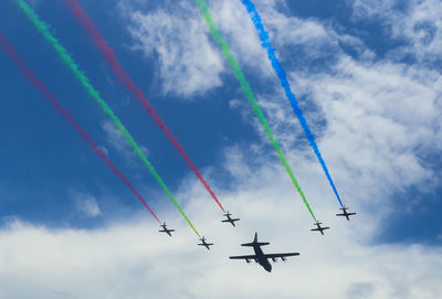 Low angle view of airplane flying against sky