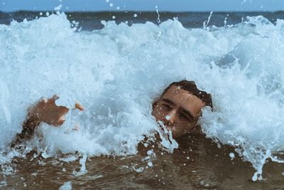 Portrait of man swimming in sea