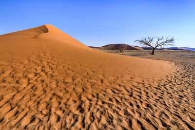 Scenic view of desert against clear sky