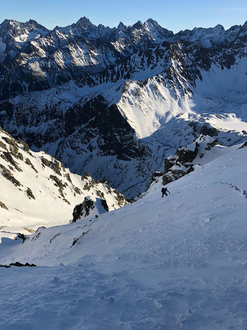 SNOW COVERED MOUNTAINS AGAINST SKY