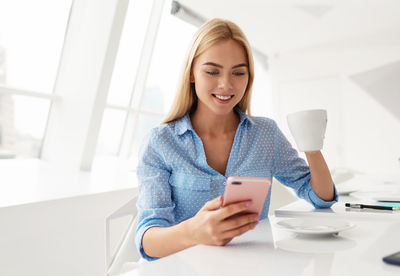 Young woman using smart phone