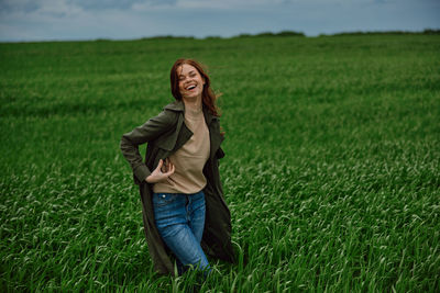 Young woman standing on field