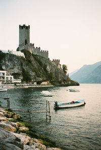 Scenic view of lago di garda sea against clear sky in italy. shot on 35mm kodak portra 800 film.