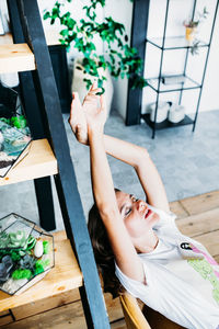 High angle view of woman lying on table