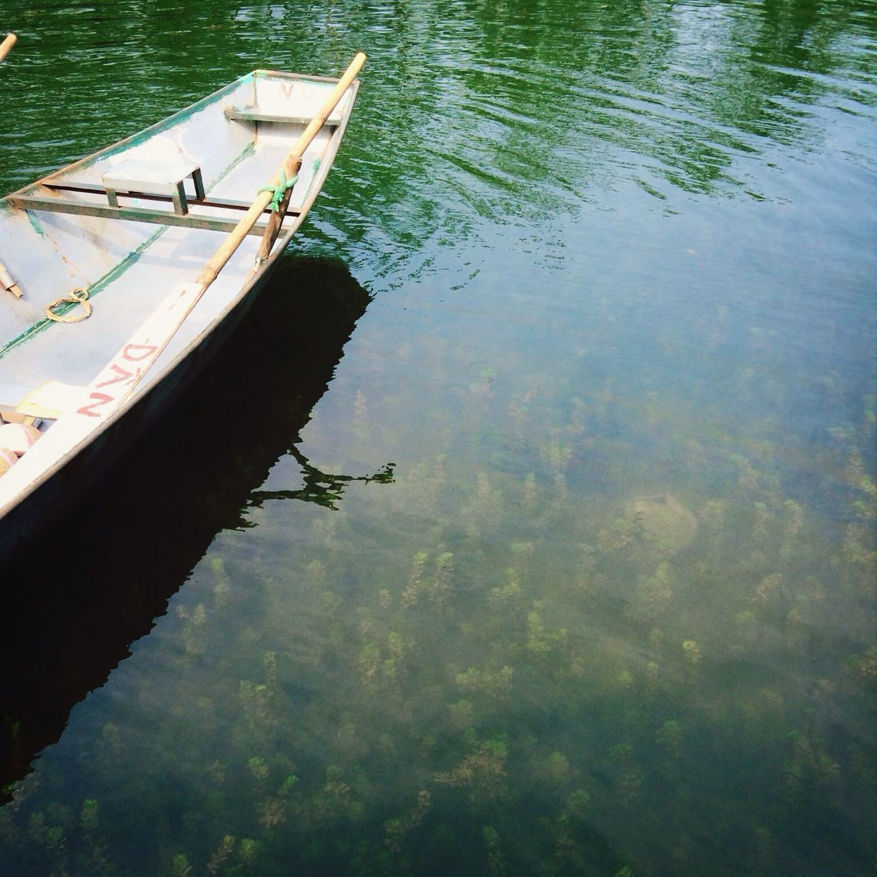 water, nautical vessel, lake, boat, high angle view, transportation, reflection, mode of transport, waterfront, rippled, moored, nature, tranquility, river, outdoors, day, tranquil scene, beauty in nature, swimming, lakeshore
