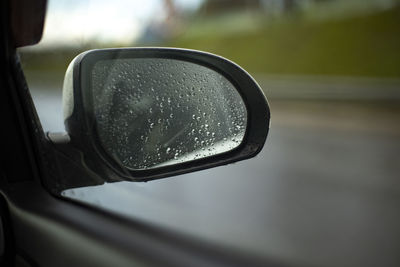 Close-up of car on side-view mirror