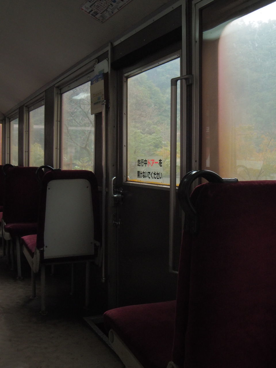 glass - material, window, seat, transparent, indoors, empty, vehicle interior, train, public transportation, no people, mode of transportation, rail transportation, absence, transportation, train - vehicle, chair, vehicle seat, day, passenger train, railroad car