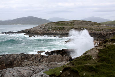 Scenic view of sea against cloudy sky