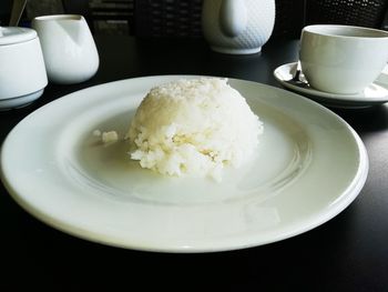 Close-up of coffee and spoon on table