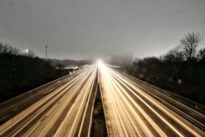 High angle view of light trails on highway