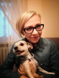 Portrait of smiling young woman with dog