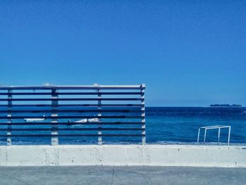 Scenic view of sea against clear blue sky