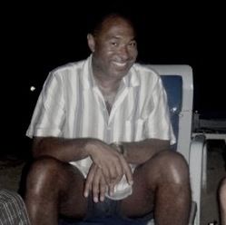 Portrait of a smiling young man sitting on chair