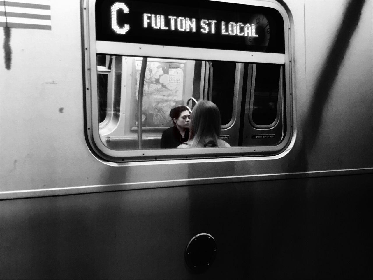 window, transportation, glass - material, communication, transparent, reflection, mode of transport, public transportation, close-up, vehicle interior, incidental people, person, curiosity, mammal, day, focus on foreground