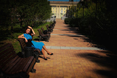 Portrait of man sitting on bench