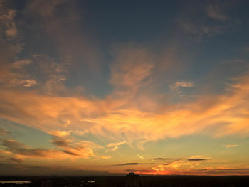 Low angle view of dramatic sky during sunset