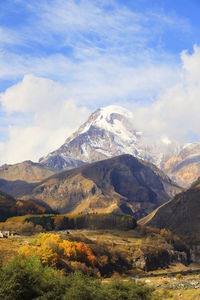 Scenic view of snowcapped mountains against sky