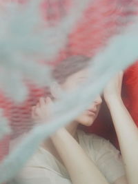 Close-up of woman hand on window