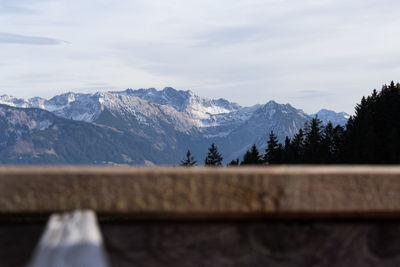 View of snowcapped mountain against cloudy sky