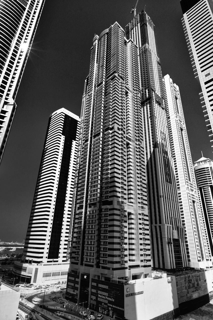 LOW ANGLE VIEW OF MODERN BUILDINGS AGAINST SKY