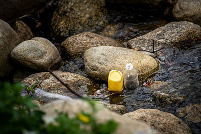 Close-up of stones in shallow water