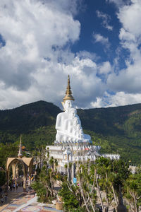 Temple building against cloudy sky