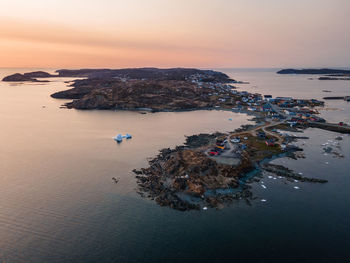 High angle view of beach against sky during sunset