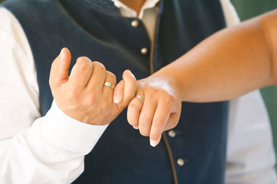 Close-up of young couple's hands