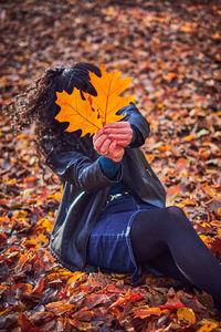 Maple leaf on autumn leaves