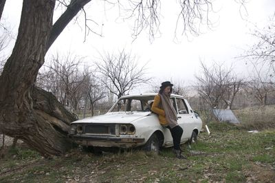 Abandoned car on field