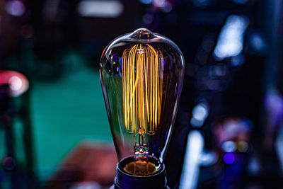 Close-up of illuminated light bulb